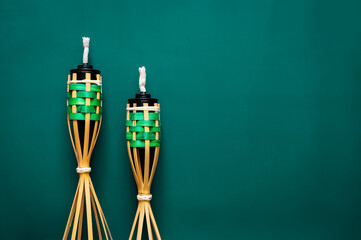 Pelita or know as oil lamp on green background for the Muslim feast of the holy month of Ramadan Kareem.