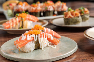 Crab Stick Sushi with Mayonnaise Sauce with Sushi Set Including Nigiri and Maki