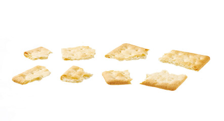 Broken square water crackers isolated on white background.