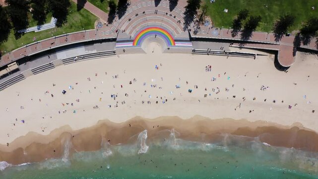 Aerial of Coogee beach crowded with people in summer, Sydney, New South Wales, Australia