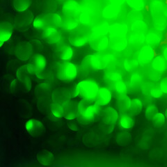 Abstract emerald green color glitter bokeh festive celebration glitz glamour texture sparkle holiday party background isolated on black