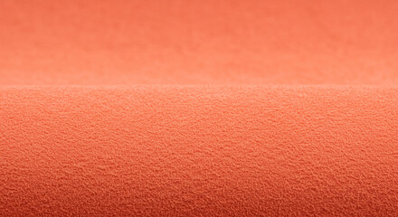 A vibrant orange fabric with a subtle textured pattern, creating a visually appealing and tactile experience
