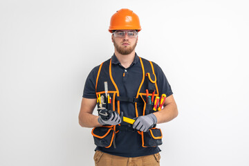 Male builder. Electrical engineer in overalls and helmet on light background. Construction concept.