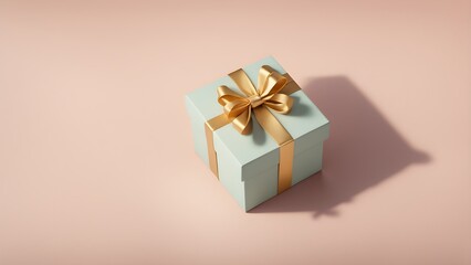 Obraz premium A pale green gift box with a gold ribbon sits on a blush pink background, casting a soft shadow.