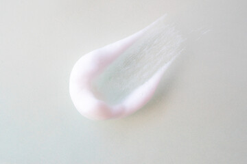 Smear of foam bubbles on a light background