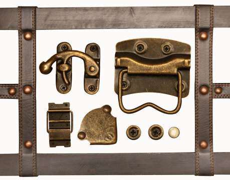 Details of the leather and bronze trim on retro trunk. Vintage chest decor set. Collection of belt, metal button and rivets, hinge, metallic decorative ornament. Isolated on white background