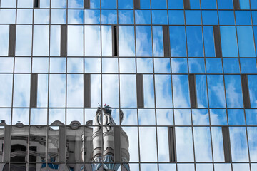 A modern office building with glass windows. Architecture design of buildings.