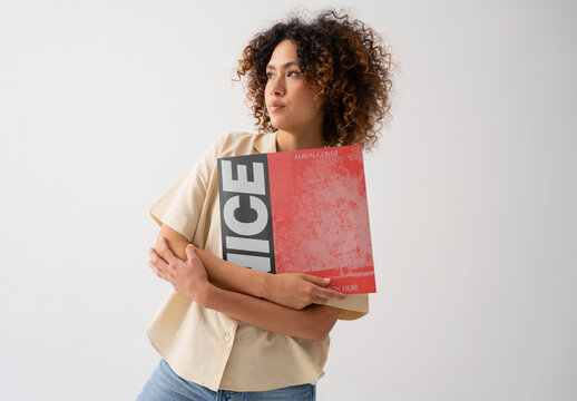 Mockup Of Woman Holding Customizable Album In Sleeve