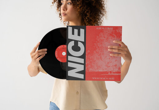 Mockup Of Woman Holding Record And Customizable Sleeve