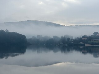 Fog over the river Minho valley landscape during misty morning, Eiras, O Rosal, Galicia, Spain, January 2024