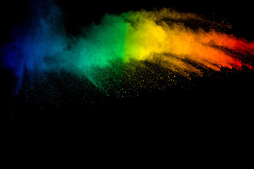 Rainbow color dust splash on black background.