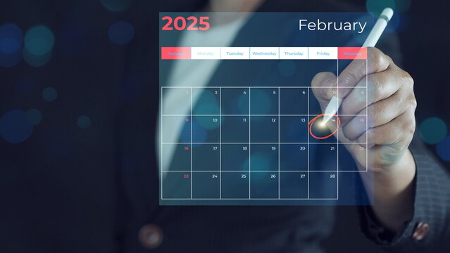 Calendar agenda appointment meeting schedule concept. Businessman using pen to write circle red mark on virtual calendar. .Valentine's Day