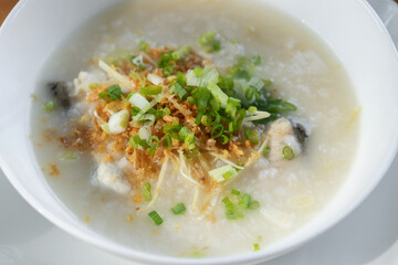 Rice congee with soft-boiled egg flavor with pickled chili vinegar and ground dried chilies