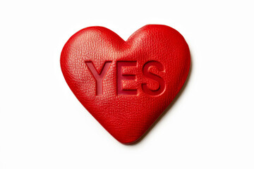 Fototapeta premium Red Heart-Shaped Cushion with 'YES' Text: Love, Affirmation, and Romance Concept