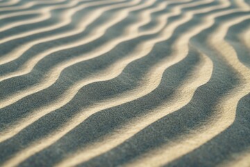 Fototapeta premium Gentle ripples form beautiful patterns on the sand at a tranquil beach, illuminated by soft lighting, capturing the essence of nature's artistry and calmness. With copy space for text