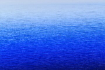 Obraz premium Mountain Lake Gradient: A mountain lake with water transitioning from clear near the shore to deep blue in the center.