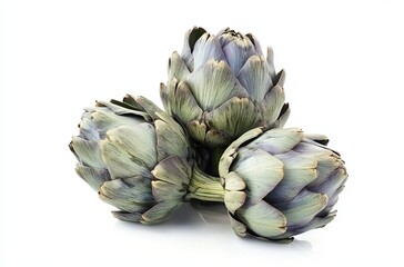 Obraz premium Pile of three artichokes isolated on a white background
