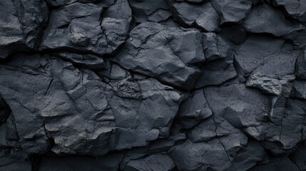 Textured Black Rock Surface with Natural Patterns and Irregular Shapes in Abstract Composition