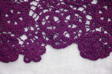 purple crochet composition close up on white background. Decorative floral background made of crochet flowers
Lace on white. Crochet. Handmade