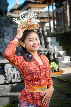 Traditional Balinese Woman Holding Offering