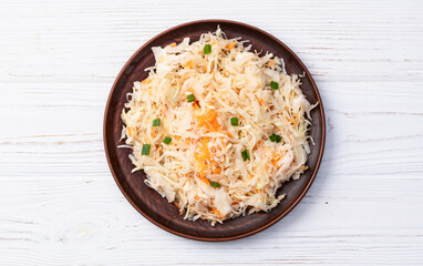 Tasty marinated cabbage with carrot, healthy food  Sauerkraut photography . Top view