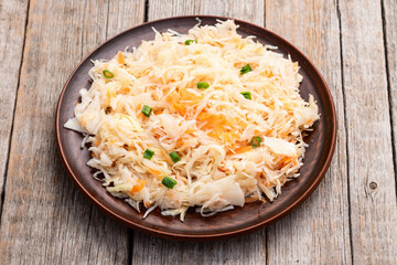 Tasty marinated cabbage with carrot, healthy food  Sauerkraut photography . Top view