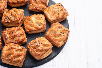 Flaky Pastries with Sesame Seeds on Slate