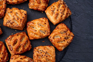 Flaky Pastries with Sesame Seeds on Slate
