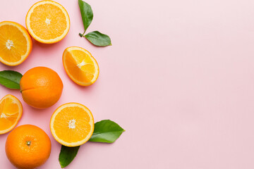 fresh Fruit orange slices on colored background. Top view. Copy Space. creative summer concept. Half of citrus in minimal flat lay with copy space