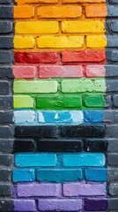 Fototapeta premium Brightly painted bricks form an eye-catching mural that brings life to a dull wall. The colorful section radiates energy, inviting onlookers to appreciate urban artistry in a lively neighborhood
