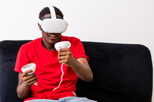 young black man playing games with a virtual reality headset