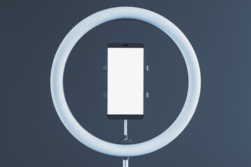 Smartphone in ring light holder on dark background. 3D Rendering