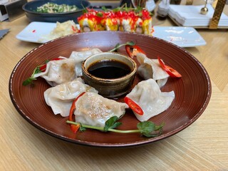 Japanese Gyoza dumplings with beef in a plate on Japanese restaurant table
