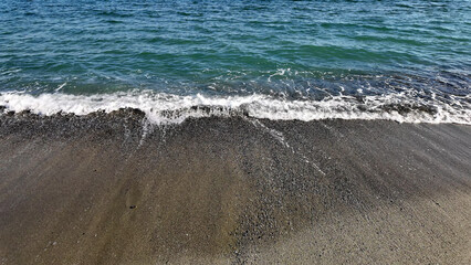 Ocean sea Aegean waters with sandy beach in Greece.