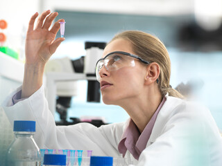 Scientist preparing a sample in a vial ready for analysis in the laboratory