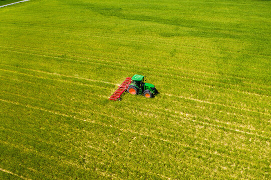 Aerial view of tractor on field, soil loosening, Hochtaunuskreis, Hesse, Germany