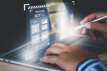 Businessman Young Smart farmer using smart computer, directive track control agriculture Farm, icon futuristic AI data, Control agricultural production technology industry system and trading orders.