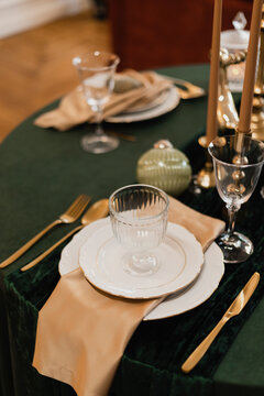 Dishes and silverware arranged on table at restaurant