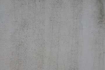 Surface of an old concrete wall showing texture and cracks in a building located in Albania