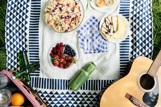 Top view of healthy picnic snacks on a blanket
