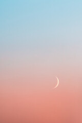 Crescent moon in pastel gradient sky