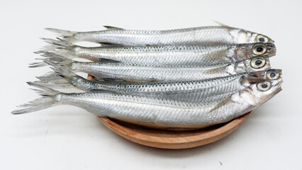 Fresh Capelin Fish or Shisamo Baby Fish on White Table Background