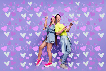 Fototapeta premium Photo of carefree funny couple dance disco retro event empty space wear pin-up outfit isolated violet color background