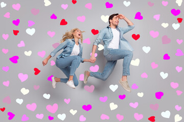 Profile photo of active couple jump look excited empty space wear casual jeans outfit isolated grey color background