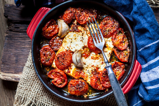 Grilled feta cheese with tomatoes and garlic