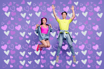 Photo of carefree youth cheerful friends jump have fun wear pin-up outfit isolated violet color background