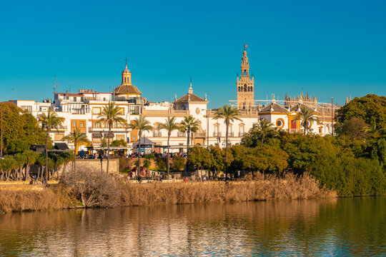 Cityscape with Guadalquivir river, Cathedral of Seville with La Giralda, Seville, Spain