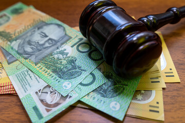 judge hammer with australian dollar money on desk.  Crime corruption concept a