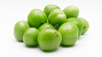 green tomatoe isolated on white background