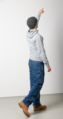 Young adult male in opoiedi seen from behind. Whole body isolated on white background
